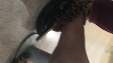 Candid brazilian girl dangling shoes