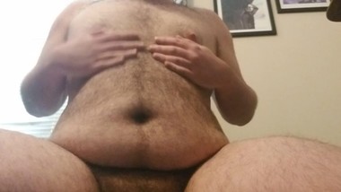Chubby teen plays with his belly