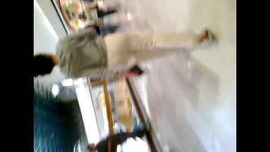 Girl in pajamas walking in shopping plaza