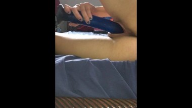 Amateur petite teen masturbates with dildo while watching lesbian porn