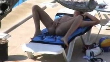 Fingering her pussy poolside