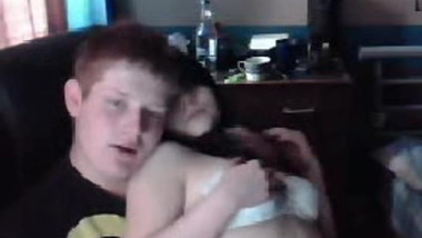 Young couple having fun in front of the webcam