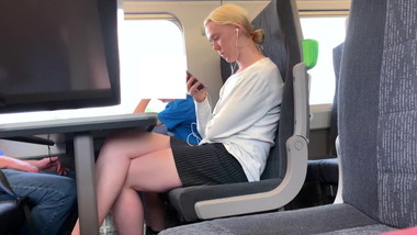 Blonde teen legs on train