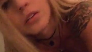 Teen blonde bimbo shows her big tits