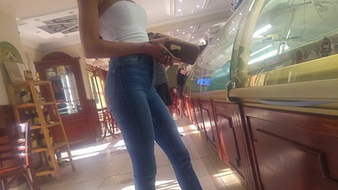 Young skinny mom in shop