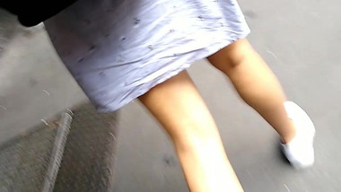 Pretty skinny young legs walking the streets teen legs