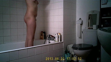 Teen with big tits takes a bath