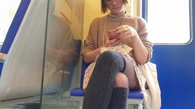 Nerdy girl crossed legs pantyhose on train