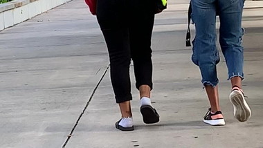 Two good teens with shapes walking to class
