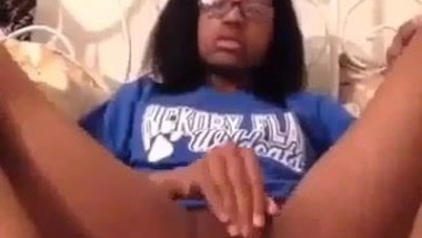 a black girl playing with her pussy