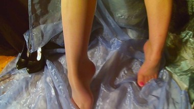 Puts on seamless pantyhose and white stayup's